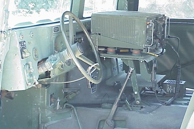 A left front view of a U.S. Army M998 High-Mobility Multipurpose Wheeled  Vehicle (HMMWV) equipped with an M220A1 tube-launched, optically-tracked,  wire-guided (TOW) missile launcher during testing - PICRYL - Public Domain  Media
